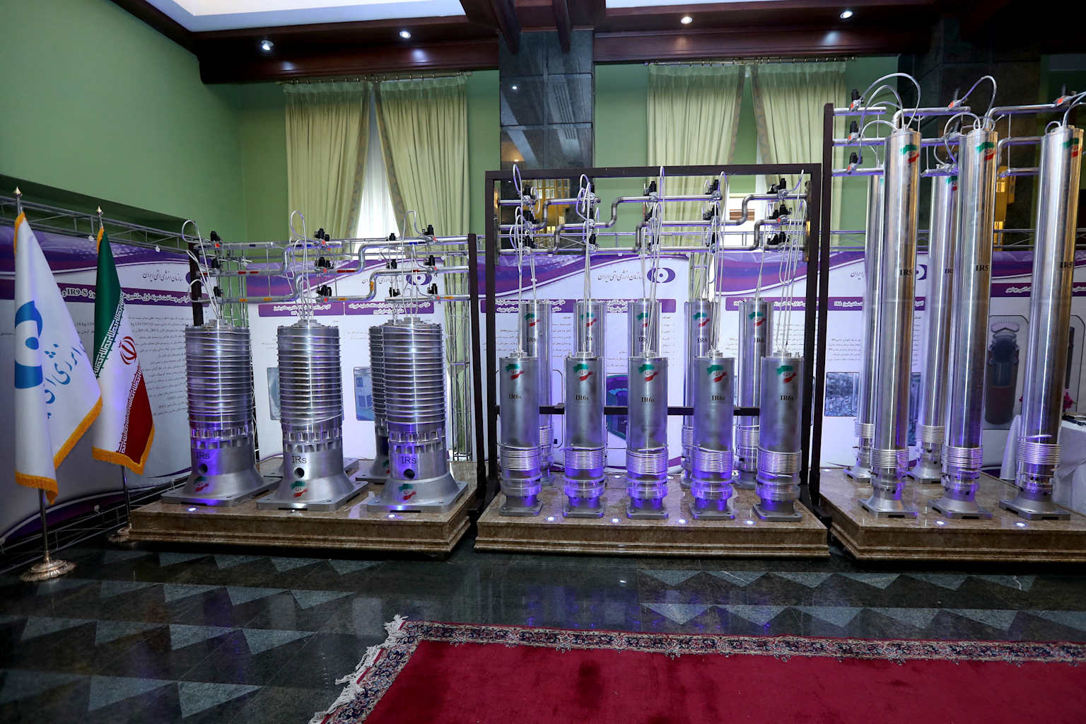 A display of various advanced Iranian centrifuges, including IR5, IR6s, and IRS models, used for uranium enrichment.