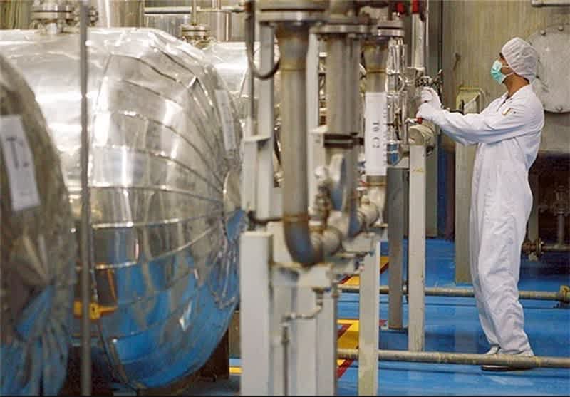 Worker injecting UF6 into IR-8 centrifuges at an Iranian nuclear facility.