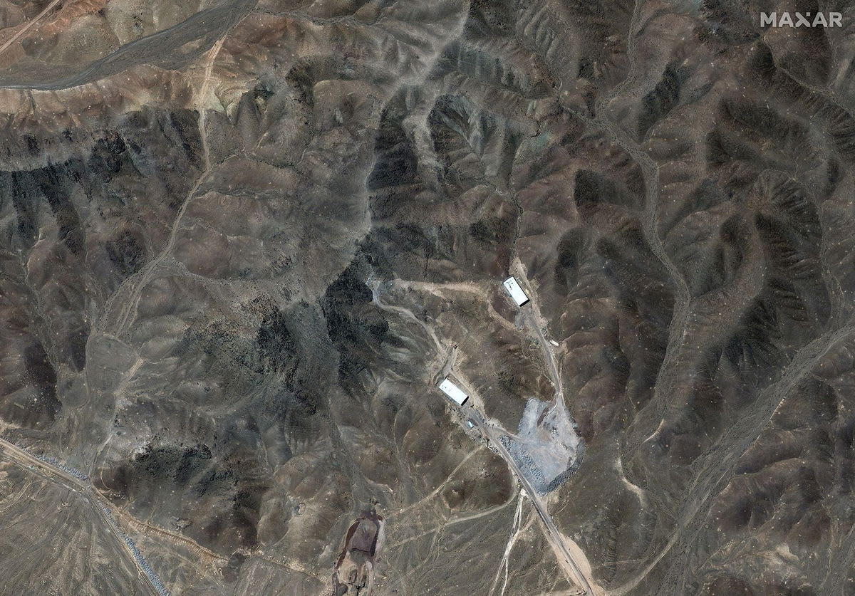 Maxar satellite image showing Fordow's tunnel structures built into mountainous terrain.