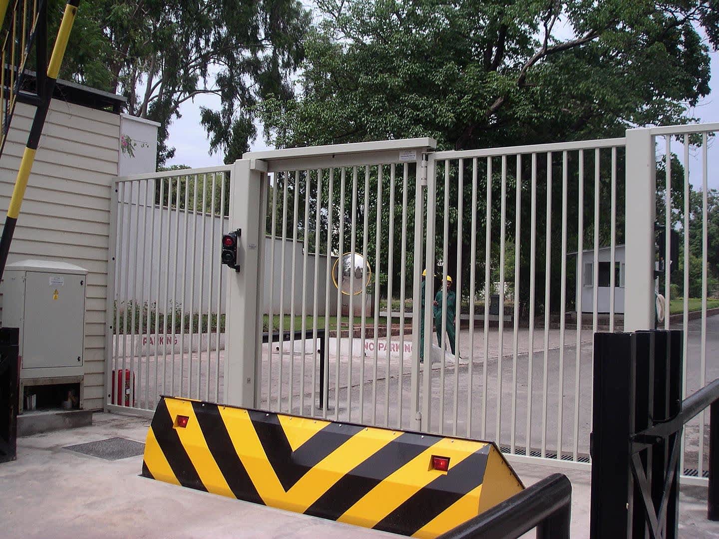 A security gate and wedge barrier system providing access control at a facility's entrance.