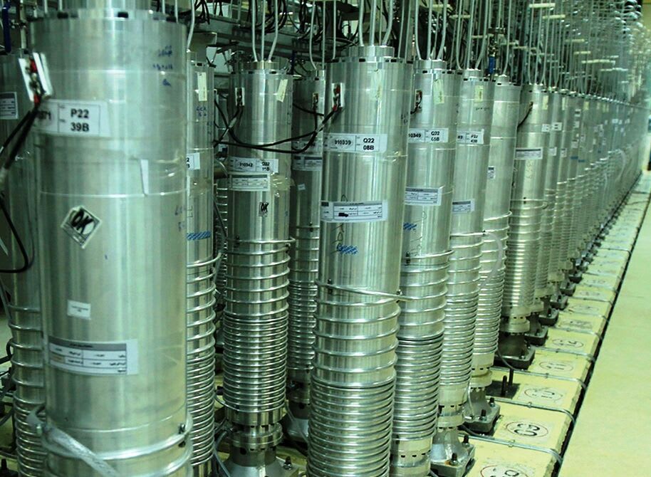 A row of advanced centrifuges, potentially IR-6 models, within a facility for uranium enrichment.