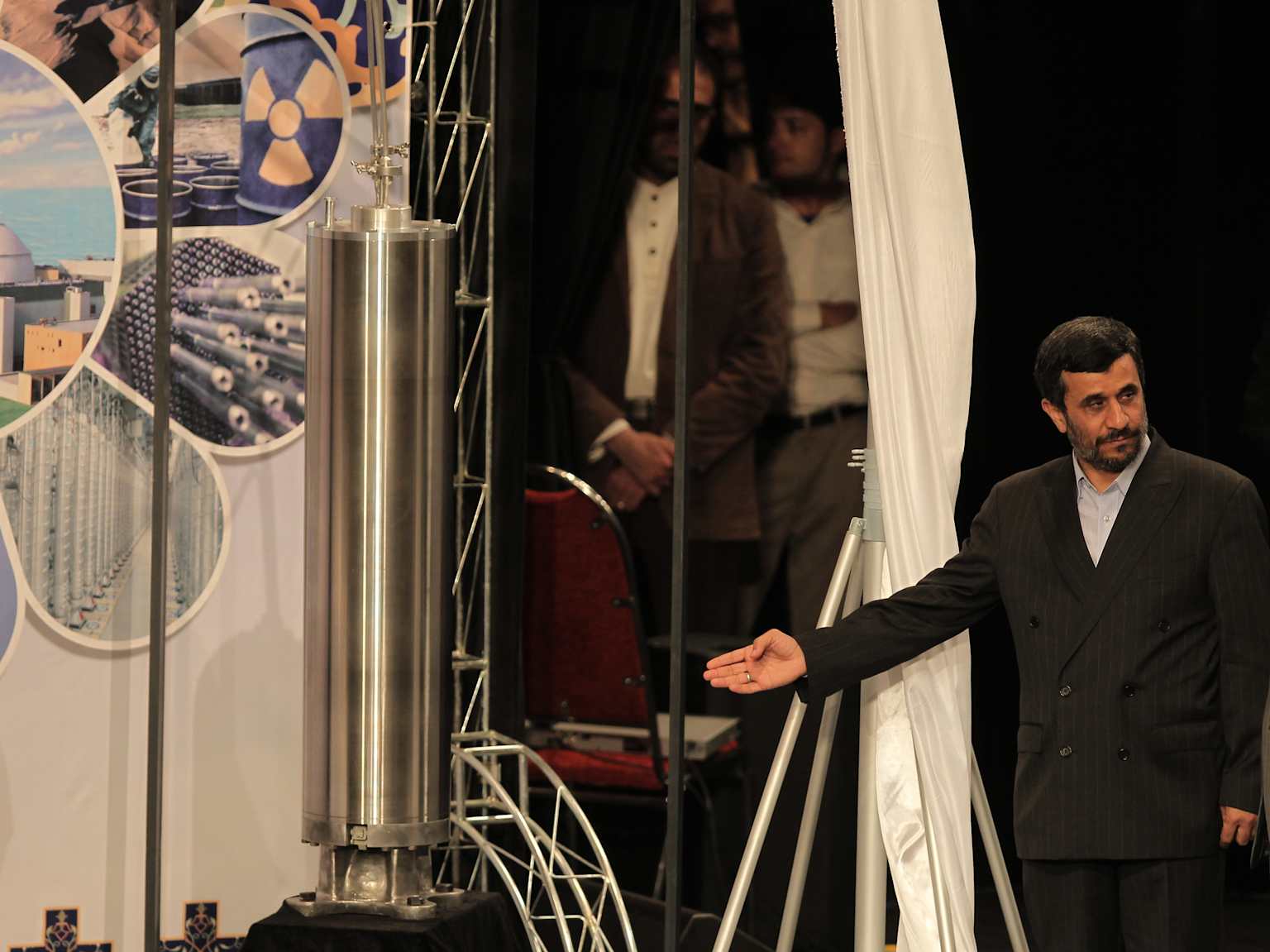 Former Iranian President Mahmoud Ahmadinejad presenting what appears to be an IR-1 centrifuge.
